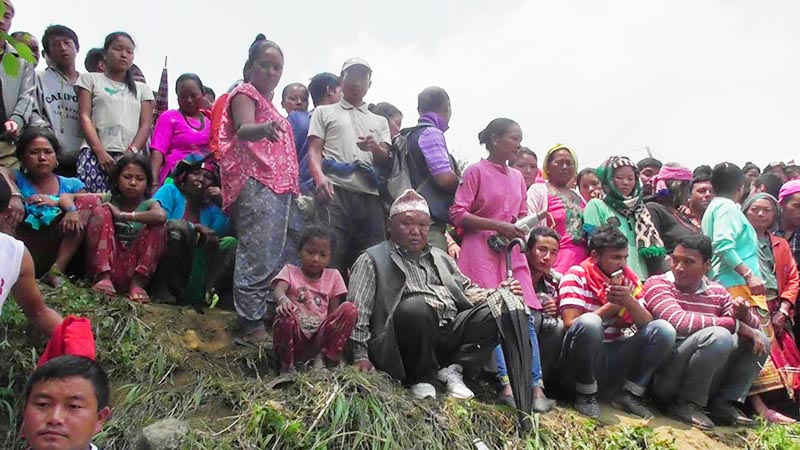 Locals gathering outside the house of Bam Bahadur Phiyak in Arubote area of Miklajung Rural Municipality in Panchthar district, on Tuesday, May 21, 2019. Four members of Bamu2019s family and five members of his son-in-lawu2019s family in another house were murdered in cold blood on Monday night. Photo: THT