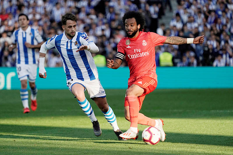 Real Madrid's Marcelo in action with Real Sociedad's Adnan Januzaj. Photo: Reuters