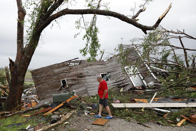 Joe Armison looks over his destroyed barn after a tornado struck the outskirts of Eudora, Kan., Tuesday, May 28, 2019. Photo: AP