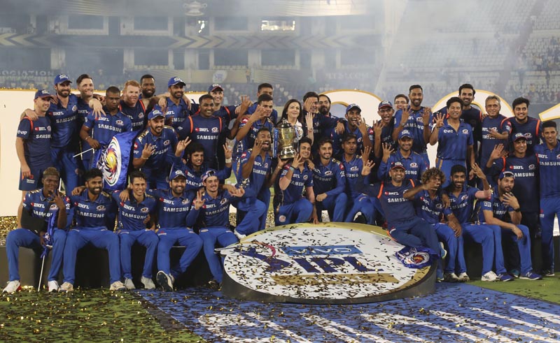 Members of Mumbai Indians team and team owner Nita Ambani (center) pose with the trophy after their win over Chennai Super Kings in the final cricket match of VIVO IPL T20 in Hyderabad, India, early Monday, on May 13, 2019. Photo: AP
