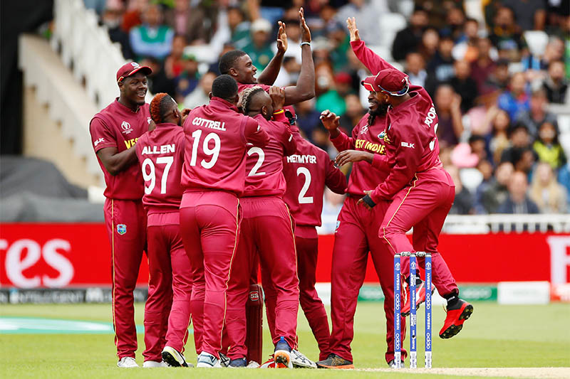 West Indies' Jason Holder celebrates with team mates after taking the wicket of Pakistan's Sarfaraz Ahmed. Photo: Reuters