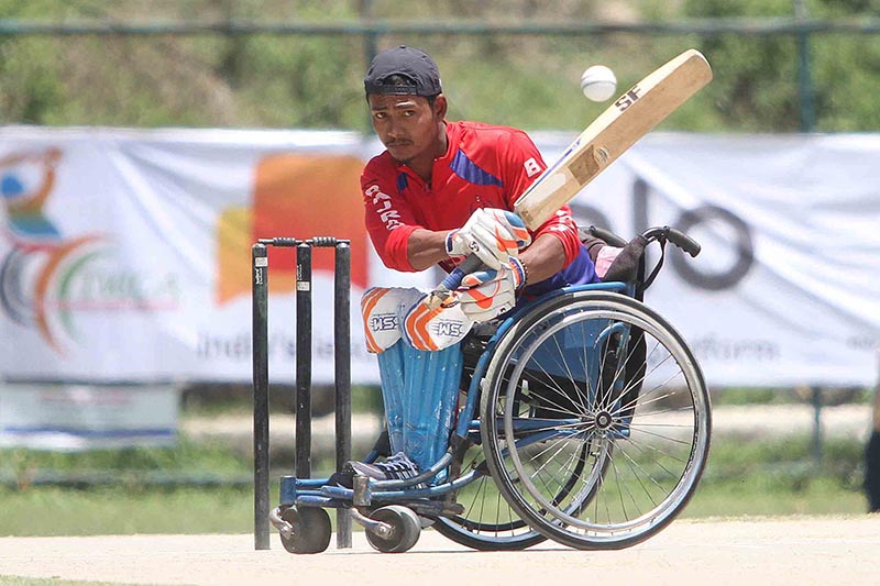 Bishnu Pukar Shrestha of Nepal bats against Pakistan during their Wheelchair Asia Cup T20 Cricket Tournament match at the TU Stadium in Kathmandu on Friday, May 17, 2019. Photo: Udipt Singh Chhetry/THT