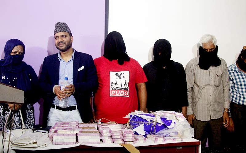 Yunus Ansari (second from left) and others who were arrested with fake currency at Tribhuvan International Airport, Kathmandu, on Friday, May 24, 2019. Photo: RSS