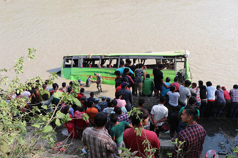 People gather around the accident site in Trishuli river, on Sunday, May 19, 2019. Photo: Keshav Adhikari/THT