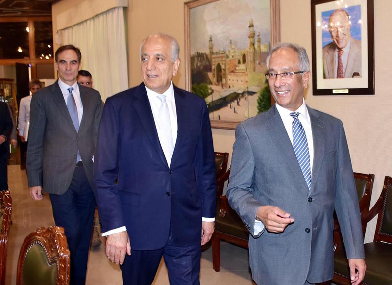 Pakistan's Foreign Ministry official Aftab Khokhar, right, escorts visiting Special Representative for Afghanistan Reconciliation Zalmay Khalilzad, centre, for talks at the Foreign Office in Islamabad, Pakistan, Sunday, June 2, 2019. Photo: Pakistan Foreign Office via AP
