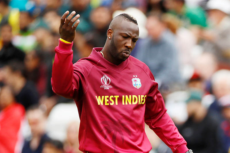 West Indies' Andre Russell signals for treatment. Photo: Reuters