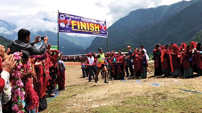 TAC's Khagendra Bhat Crosses the finishing line of the Annapurna Marathon in Kaski on Monday. Photo: THT