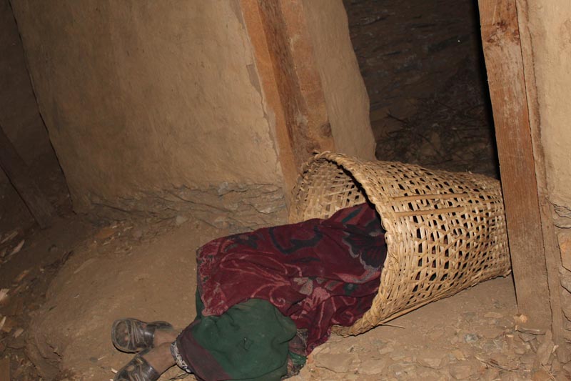 A local of sleeping outside during her menstruation in Himal Rural Municipality-1 of Bajura district. Photo: Prakash Singh