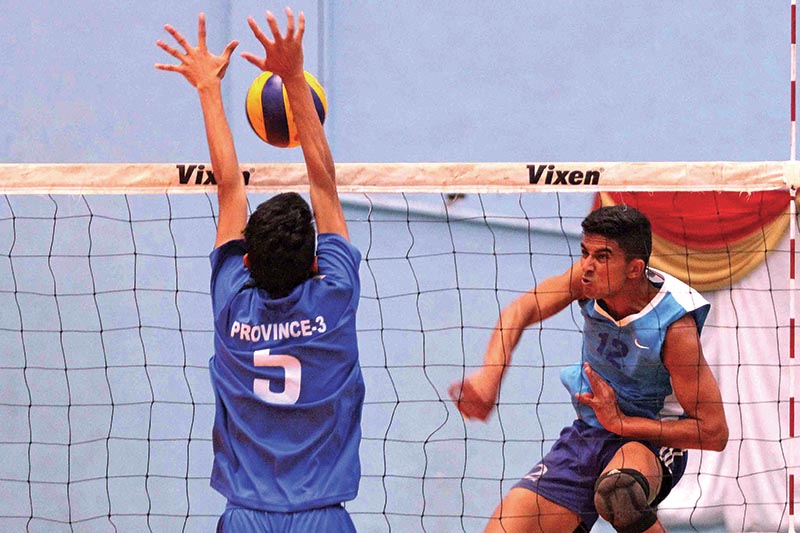Govind Parajuli (right) of Nepal Police Club attempts a spiker against Province No.3 player during the fourth CoAS Men's National Volleyball Tournament at Army Sports Complex, Lalitpur on Thursday. Photo: Udipt Singh Chhetry/ THT