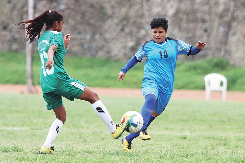 Anu Lama (right) of Bidur Municipality vies for the ball agianst Dhangdhi Sub-metropolitian players during their Deputy Mayor Cup Inter-municipality Women's National Football Tournament at APF grounds, Halchwok in Kathmandu on Saturday. Photo: Udipt Singh Chhetry/ THT