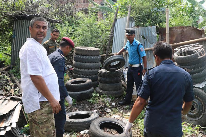 Security personnel removing old tyres from a garage in a bid to control dengue at Chhatachowk, Dharan, on Sunday, June 16, 2019.  Water accumulated in tyres provides breeding ground for mosquitoes. Photo: THT