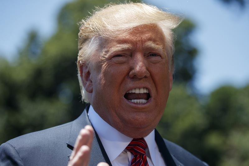 President Donald Trump speaks to reporters before departing for a trip to Iowa, on the South Lawn of White House, Tuesday, June 11, 2019, in Washington. Photo: AP