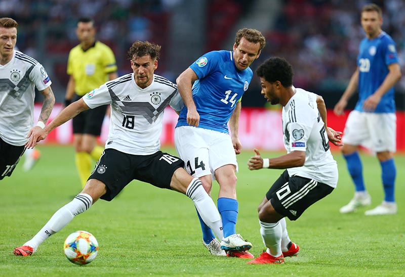 Germany's Leon Goretzka and Serge Gnabry in action with Estonia's Konstantin Vassiljev during the Euro 2020 Qualifier Group C match between Germany and Estonia, at Opel Arena, in Mainz, Germany, on June 11, 2019. Photo: Reuters
