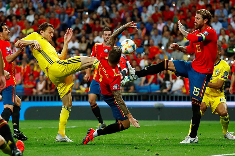 Spain's Sergio Ramos and Inigo Martinez in action with Sweden's Albin Ekdal during the Euro 2020 Qualifier Group F match between Spain and Sweden, at Santiago Bernabeu, in Madrid, Spain, on June 10, 2019. Photo: Reuters