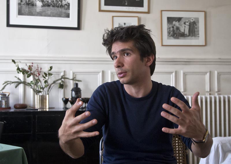Lawyer Juan Branco who co-authored a legal document alleging crimes against humanity by the European Union as he speaks during an interview with The Associated Press in Paris, France, on April 11 2019. Photo: AP/File