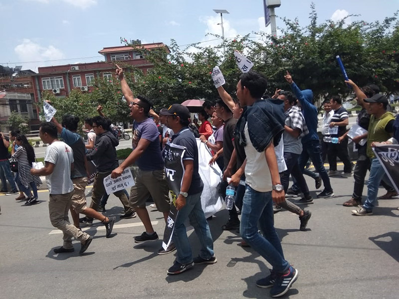 Protestors walk chanting slogans against the Guthi Bill, demanding that the bill be scrapped, at Baneshwor, in Kathmandu, on Wednesday, June 19, 2019. Photo: Kriti Joshi/THT Online