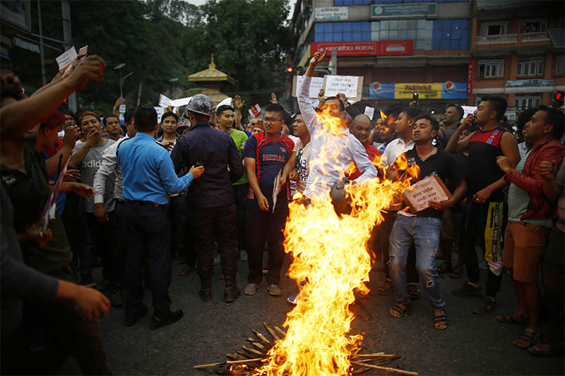 Members of indigenous Newar community stage a protest against the controversial Guthi bill at Araniko Highway in Bhaktapur, on Sunday, June 16, 2019. The protesters demand that the government withdraw the Guthi bill registered in the National Assembly which envisions nationalizing all religious sites and trusts under a powerful commission. Photo: Skanda Gautam/THT