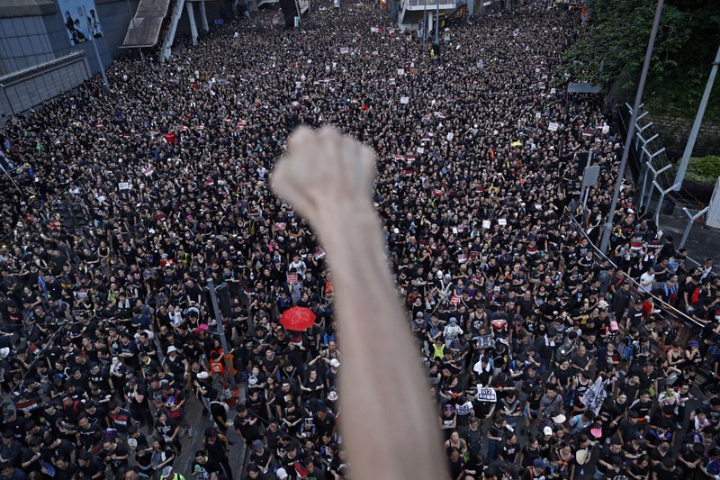 Protesters march on the streets against an extradition bill in Hong Kong on Sunday, June 16, 2019. Photo: AP