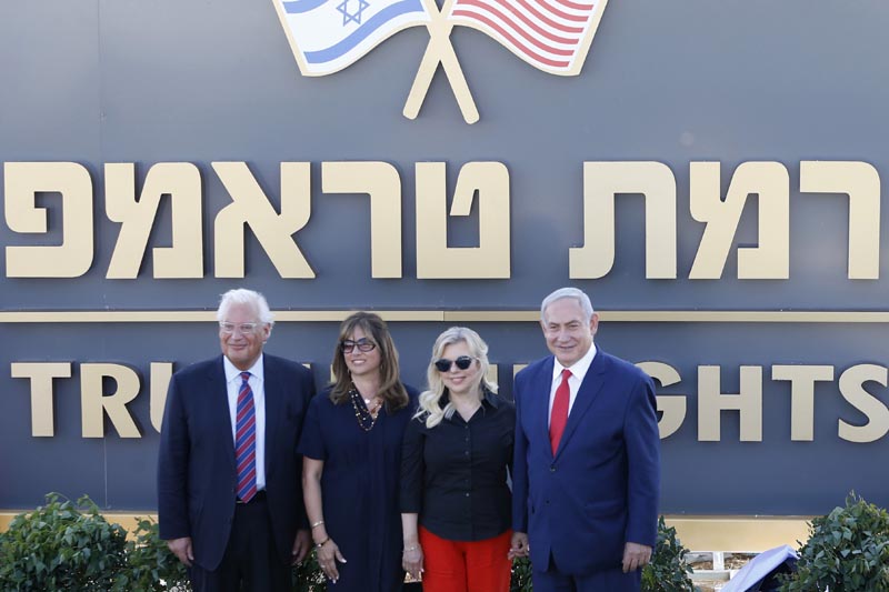 Israeli Prime Minister Benjamin Netanyahu, right, his wife Sara , United States Ambassador to Israel David Friedman, left, his wife Tammy pose during the inauguration of a new settlement named after President Donald Trump in the Golan Heights, Sunday, June 16, 2019. Photo: AP