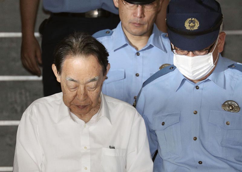 Hideaki Kumazawa, left, a former top Japanese government official, leaves a police station in Tokyo Monday, June 3, 2019. Photo: Kenzaburo Fukuhara/Kyodo News via AP