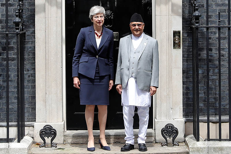 Britain's Prime Minister Theresa May poses with Nepal's Prime Minister KP Sharma Oli outside Downing Street in London, Britain, on June 11, 2019. Photo: Reuters