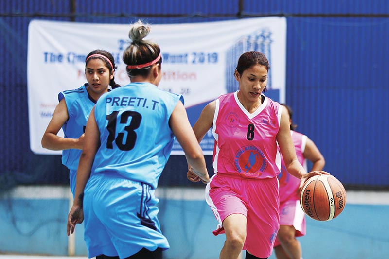 Players of NPC and Samriddhi Gorillas (right) in action during their Kwiks Nepal Basketball League match in Kathmandu on Saturday. Photo: THT