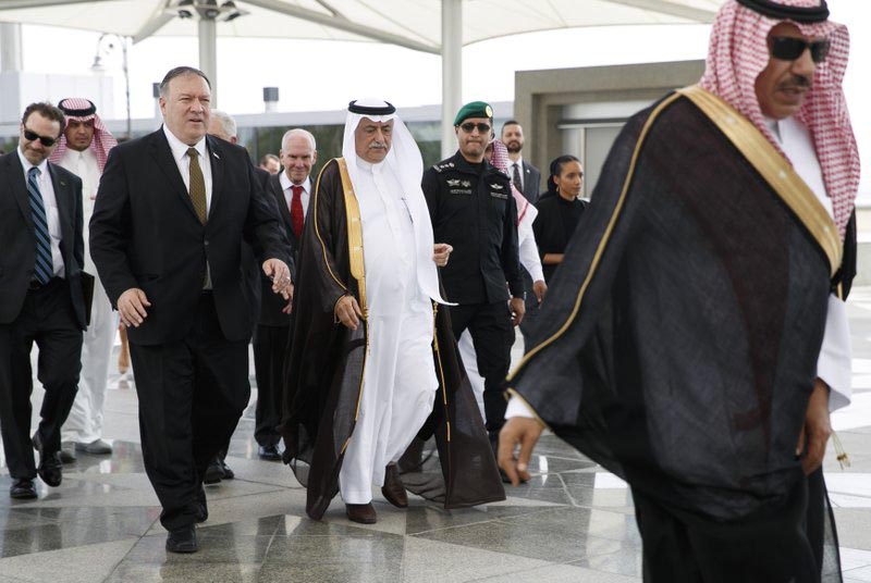 US Secretary of State Mike Pompeo, left, walks with Saudi Foreign Minister Ibrahim Abdulaziz Al-Assaf, as Pompeo arrives in Jeddah, Saudi Arabia, Monday, June 24, 2019.