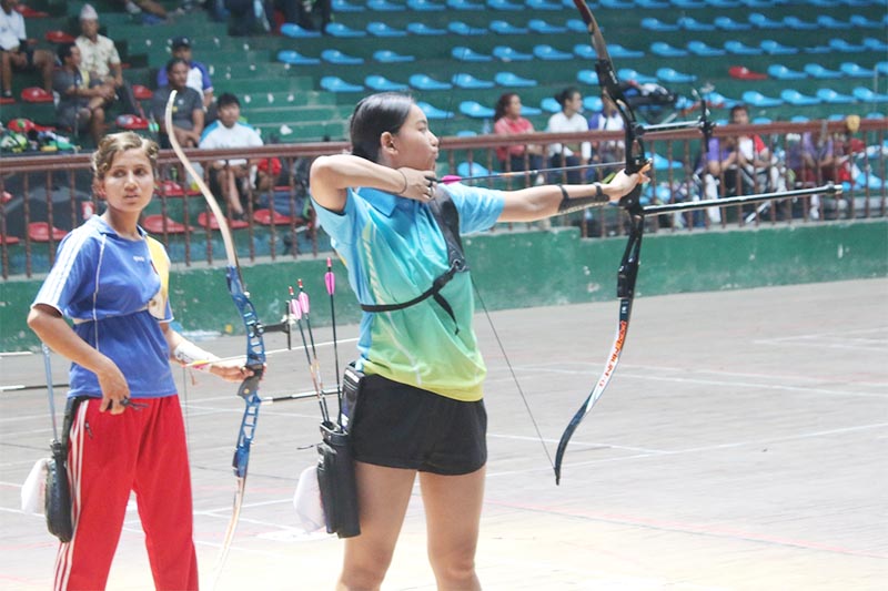 Ashna Lama from The Best Archery prepares for a shot during the Laxman Kumar Shrestha Memorial sixth National Archery Tournament in Kathmandu on Friday, June 28, 2019. Photo: THT