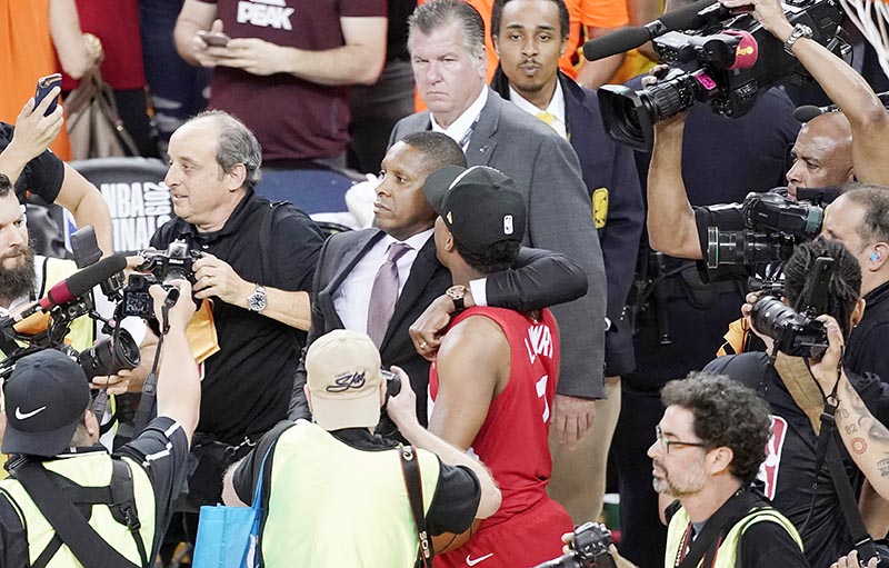 Toronto Raptors general manager Masai Ujiri (centre left), walking with guard Kyle Lowry after the Raptors defeated the Golden State Warriors in Game 6 of basketball's NBA Finals in Oakland, California, on Thursday, June 13, 2019. Photo: AP