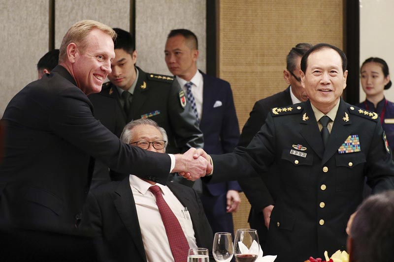 FILE: In this June 1, 2019, file photo, acting US Secretary of Defense Patrick Shanahan (left) shakes hands with Chinese Minister of National Defense General Wei Fenghe (right) during a ministerial luncheon on the sidelines of the 18th International Institute for Strategic Studies (IISS) Shangri-la Dialogue in Singapore. Photo: AP