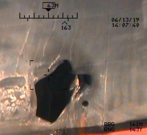 This image released by the US Department of Defense on Monday, June 17, 2019, and taken from a US Navy helicopter, shows what the Navy says is blast damage to the motor vessel M/T Kokuka Courageous, consistent with a limpet mine attack. Photo: US Department of Defense via AP