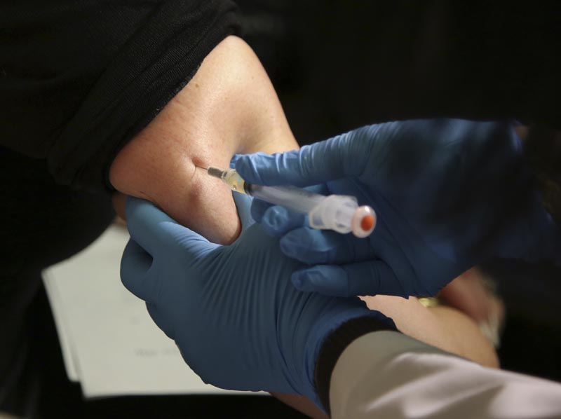 FILE: In this March 27, 2019 file photo, a woman receives a measles, mumps and rubella vaccine at the Rockland County Health Department in Pomona, NY, north of New York City. Photo: AP