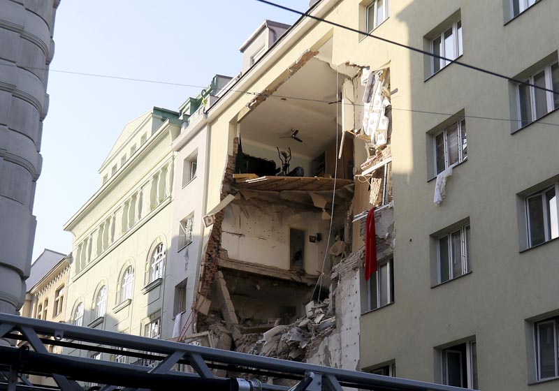 Firefighters search through the rubble of a exploded building in Vienna, Austria, Wednesday, June 26, 2019. Photo: AP
