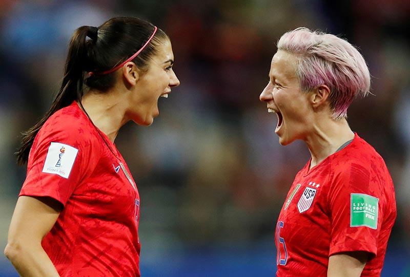 Alex Morgan of the US celebrates scoring their twelfth goal with Megan Rapinoe during the Women's World Cup Group F match between United States and Thailand, at Stade Auguste-Delaune, in Reims, France, on June 11, 2019. Photo: Reuters