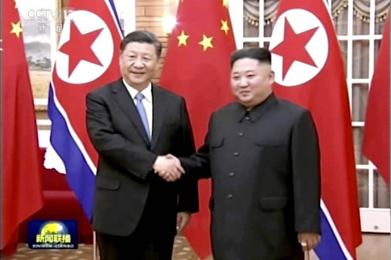In this image taken from a video footage run by China's CCTV, Chinese President Xi Jinping, left, and North Korean leader Kim Jong Un, right, shake hands before their meeting in Pyongyang, North Korea, Thursday, June 20, 2019.