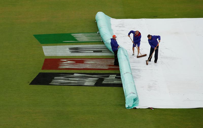 Ground staffs work on the field after a rain during the ICC Cricket World Cup (South Africa and West Indies) at The Ageas Bowl in Southampton, Britain on June 10. Photo: Action Images via Reuters