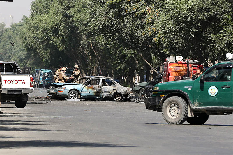 Members of Afghan security forces inspect the site of a blast near Kabul University in Kabul, Afghanistan July 19, 2019. Photo: Reuters