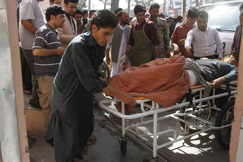 Afghans assist a wounded man in a hospital after a roadside bomb on the main highway between the western city of Herat and the southern city of Kandahar, in Herat, Afghanistan, Wednesday, July 31, 2019. Photo: AP