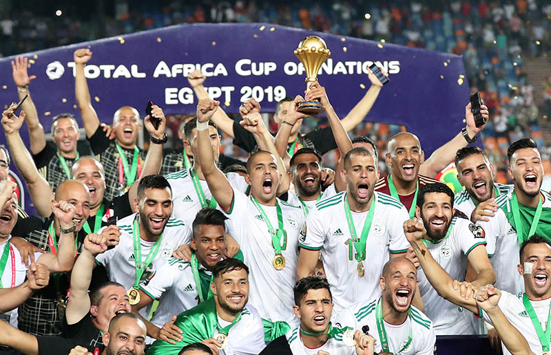 Algeria's Riyad Mahrez lifts the trophy as they celebrate winning the Africa Cup of Nations during the Africa Cup of Nations 2019 Final match between Senegal and Algeria, at Cairo International Stadium, in Cairo, Egypt, on July 19, 2019. Photo: Reuters