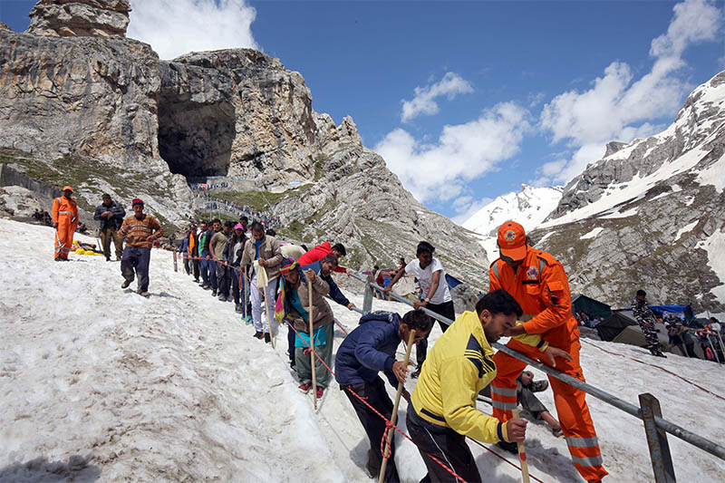 Hindu pilgrims leave the holy cave of Lord Shiva after worshipping in Amarnath, southeast of Srinagar, on Wednesday, July 03, 2019. Photo: Reuters