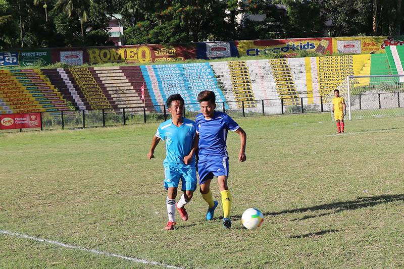 Players vie for the ball during CM Cup Football League in Dharan, on Tuesday, July 02, 2019. Photo: Santosh Kafle/THT