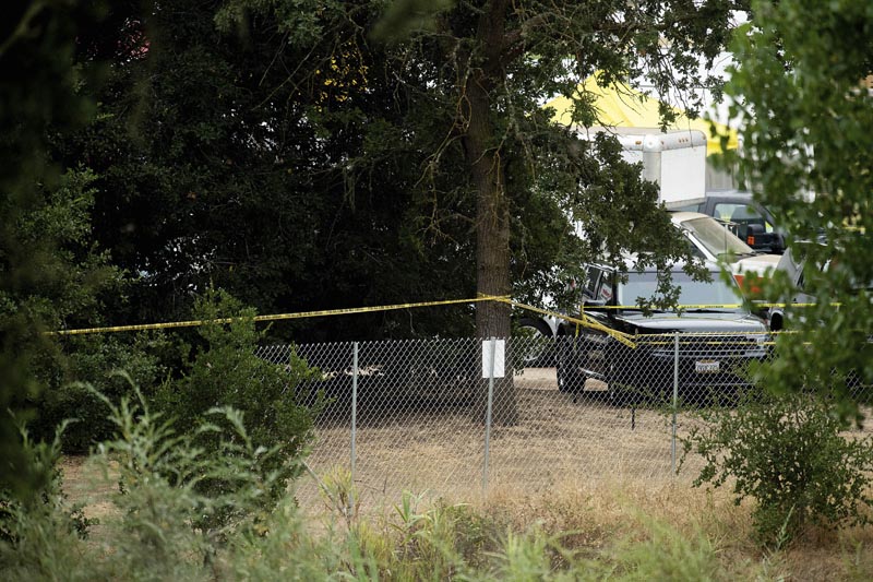 Police tape stretches behind a perimeter fence at the Gilroy Garlic Festival the morning after a deadly shooting at the food festival in Gilroy, California, Monday, July 29, 2019. Photo: AP