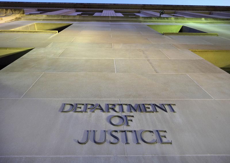 FILE - In this May 14, 2013, file photo, the Department of Justice headquarters building in Washington is photographed early in the morning. Photo: AP
