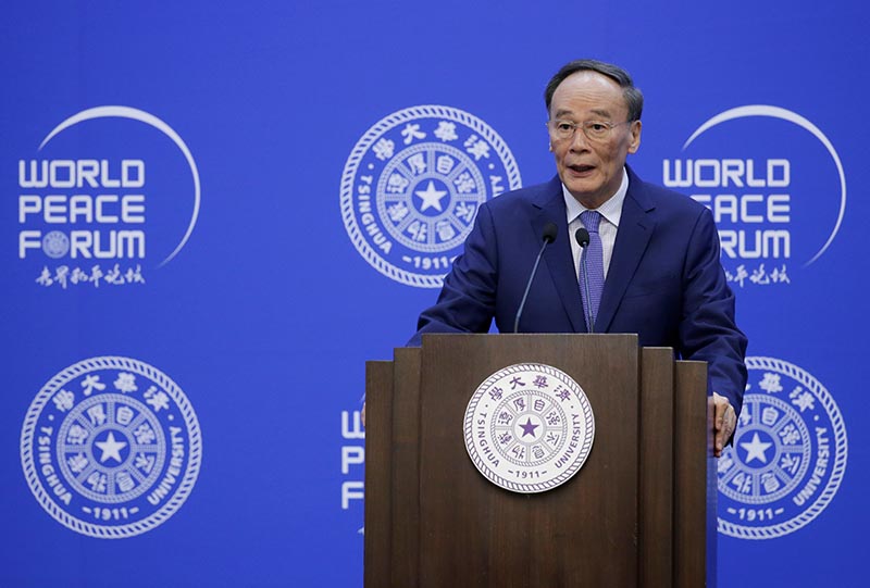 Chinese Vice President Wang Qishan delivers a speech at the opening of World Peace Forum at Tsinghua University, in Beijing, China, July 8, 2019. Photo: Reuters