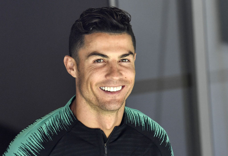 FILE - In this June 8, 2019, file photo, Portugal's Cristiano Ronaldo smiles when he arrives to a training session at the Bessa stadium in Porto, Portugal. Photo: AP
