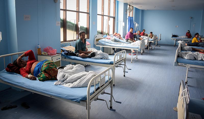 People, who were taken ill after consuming food in a rice weaning ceremony in Gajuri village of Dhading, receiving treatment at a hospital, in Kathmandu, on Sunday. Photo: Naresh Shrestha/THT
