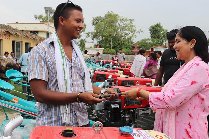 A farmer receiving a power tiller offered by Dhangadi sub-metropolis Agriculture Department at the office of the sub-metropolis in Kailali, on Thursday, July 18, 2019. Photo: THT