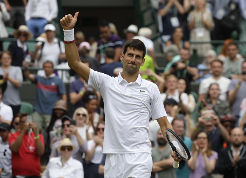 Serbia's Novak Djokovic celebrates defeating Ugo Humbert of France in a men's singles match during day seven of the Wimbledon Tennis Championships in London, Monday, July 8, 2019. Photo: AP