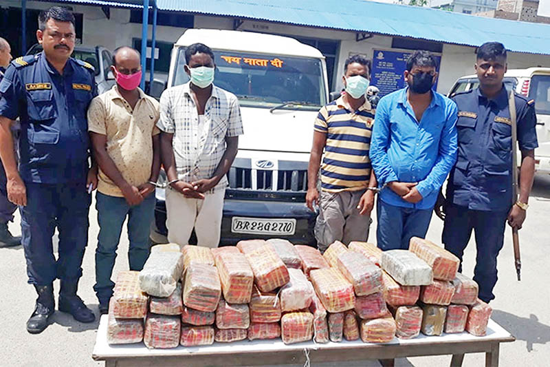 Police making public alleged drug smugglers along with seized drugs at DPO, Bara, in Birgunj, on Tuesday, July 30, 2019. Photo: Ram Sarraf/THT