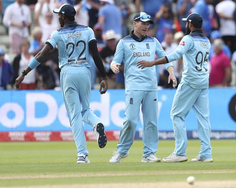 England's Captain Eoin Morgan (center) celebrates with teammates after their win over India in the Cricket World Cup match at Edgbaston in Birmingham, England, Sunday, June 30, 2019. Photo: AP